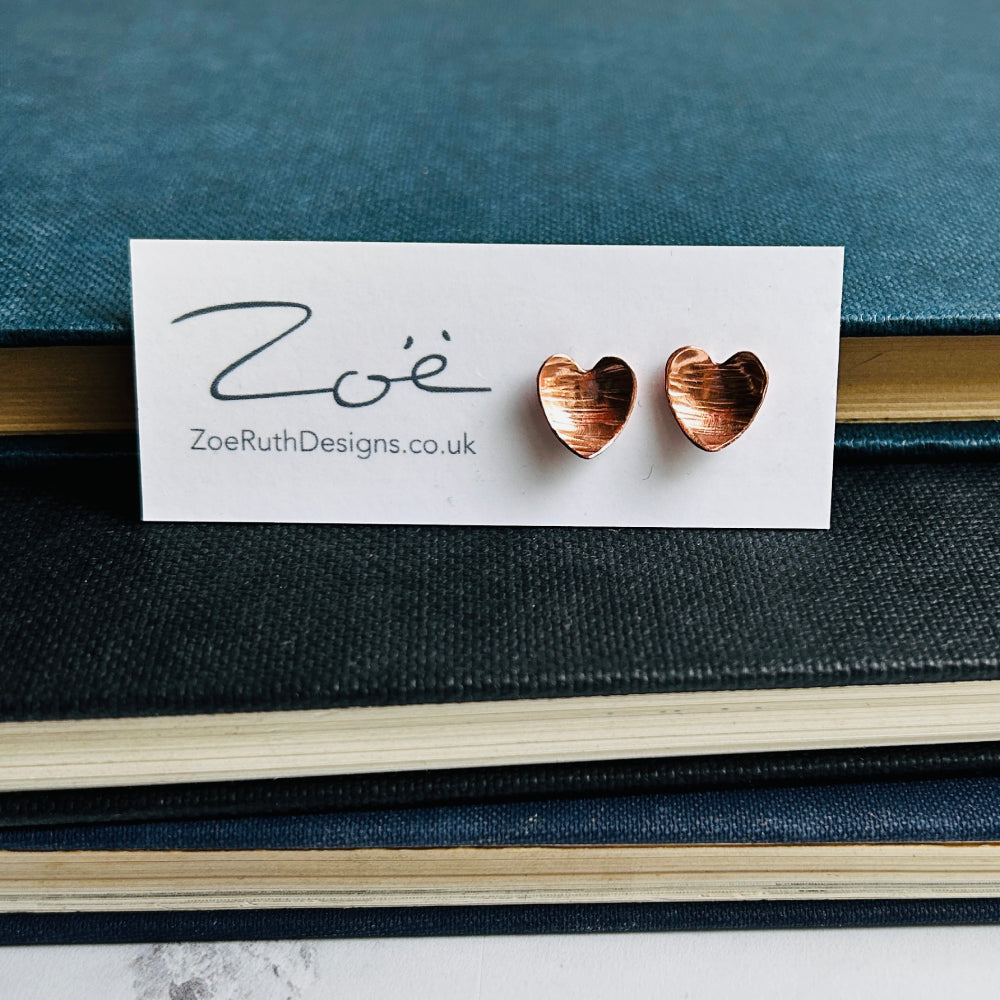 Handmade sterling silver stud earrings displayed on their logo card packaging of Zoe Ruth Designs