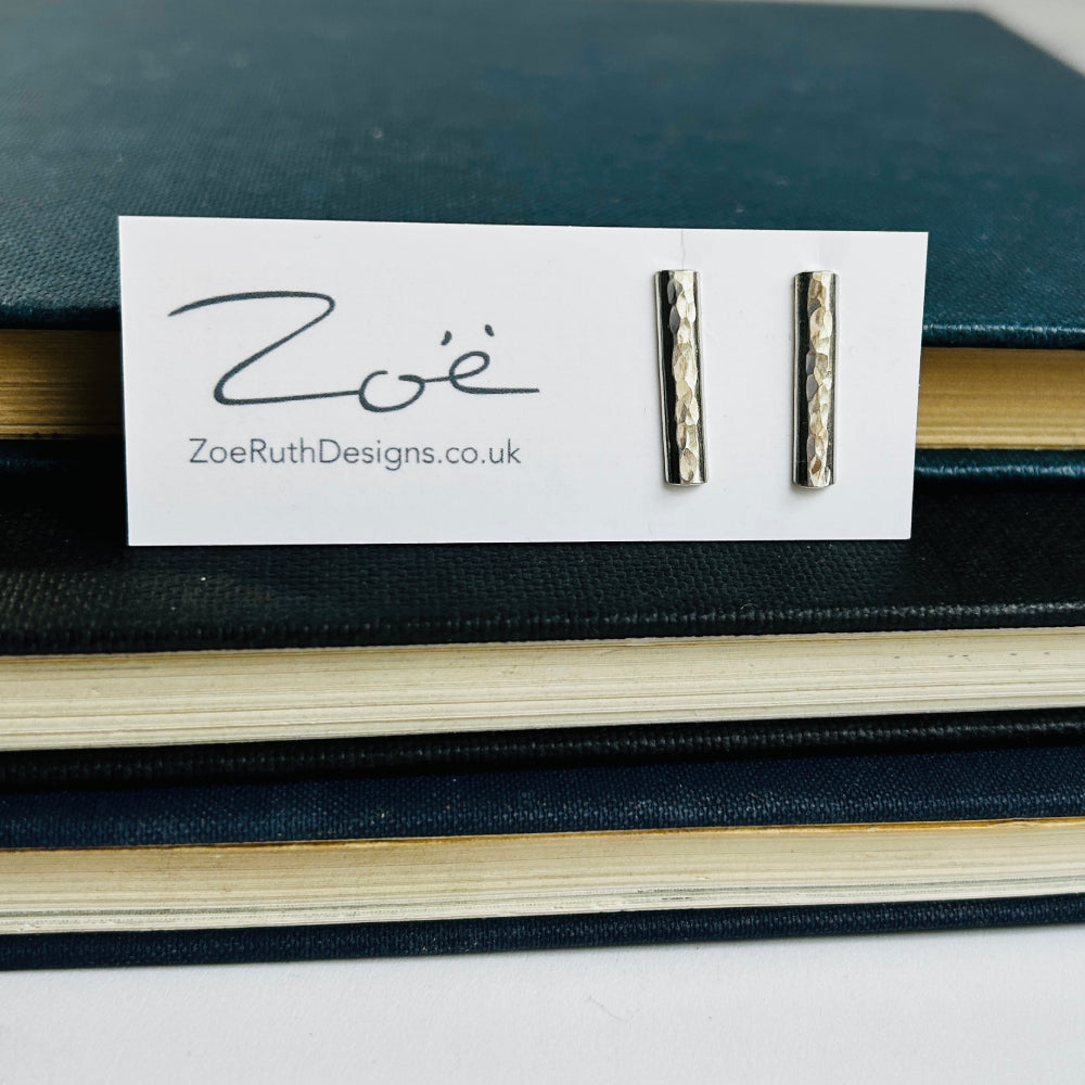Handmade sterling silver stud earrings displayed on their logo card packaging of Zoe Ruth Designs