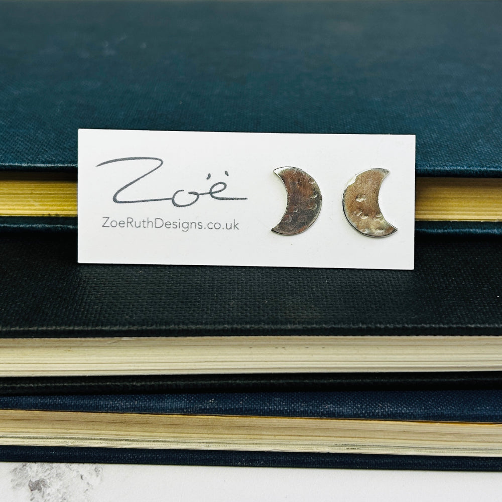 Handmade sterling silver stud earrings displayed on their logo card packaging of Zoe Ruth Designs