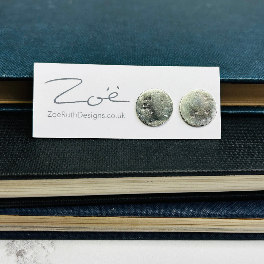 Handmade sterling silver stud earrings displayed on their logo card packaging of Zoe Ruth Designs