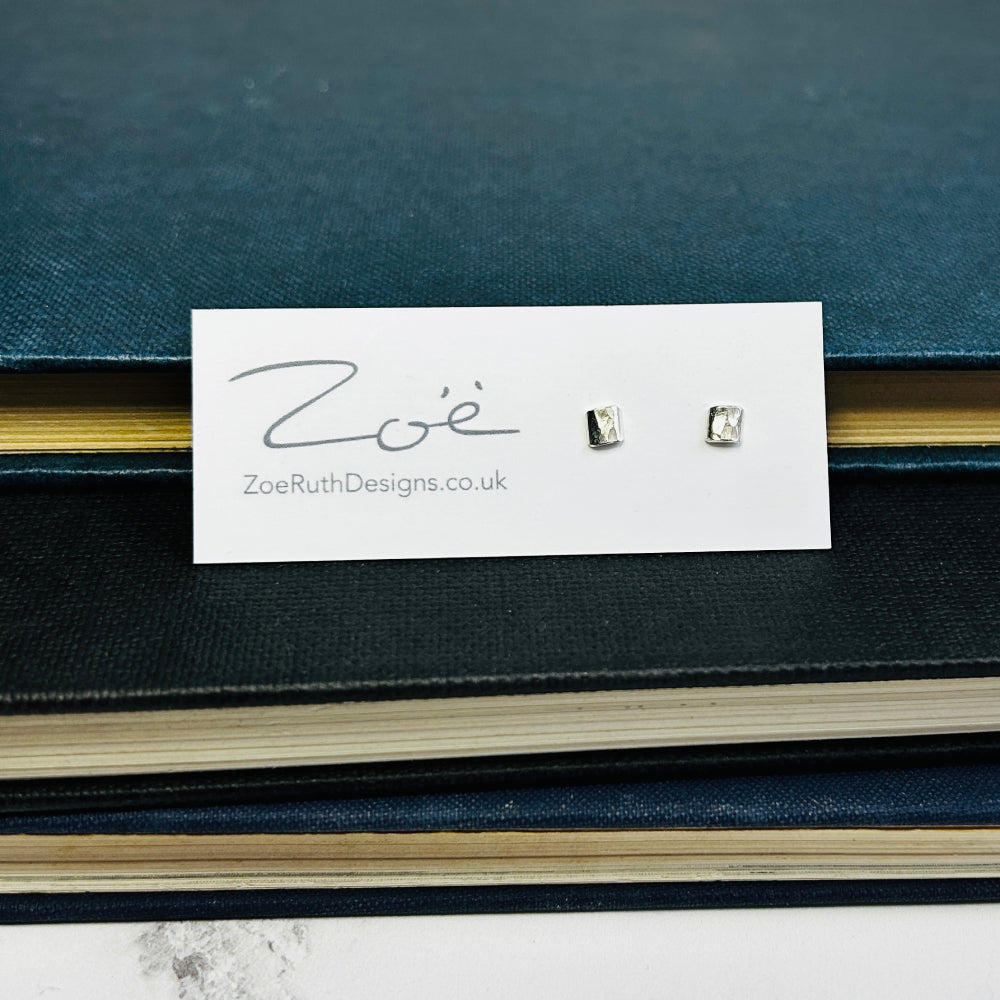 Handmade sterling silver stud earrings displayed on their logo card packaging of Zoe Ruth Designs