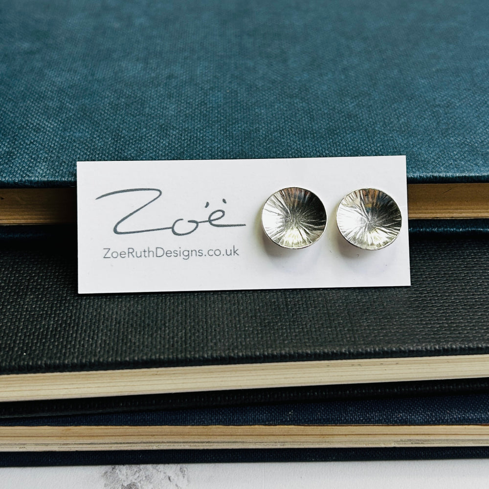 Handmade sterling silver stud earrings displayed on their logo card packaging of Zoe Ruth Designs