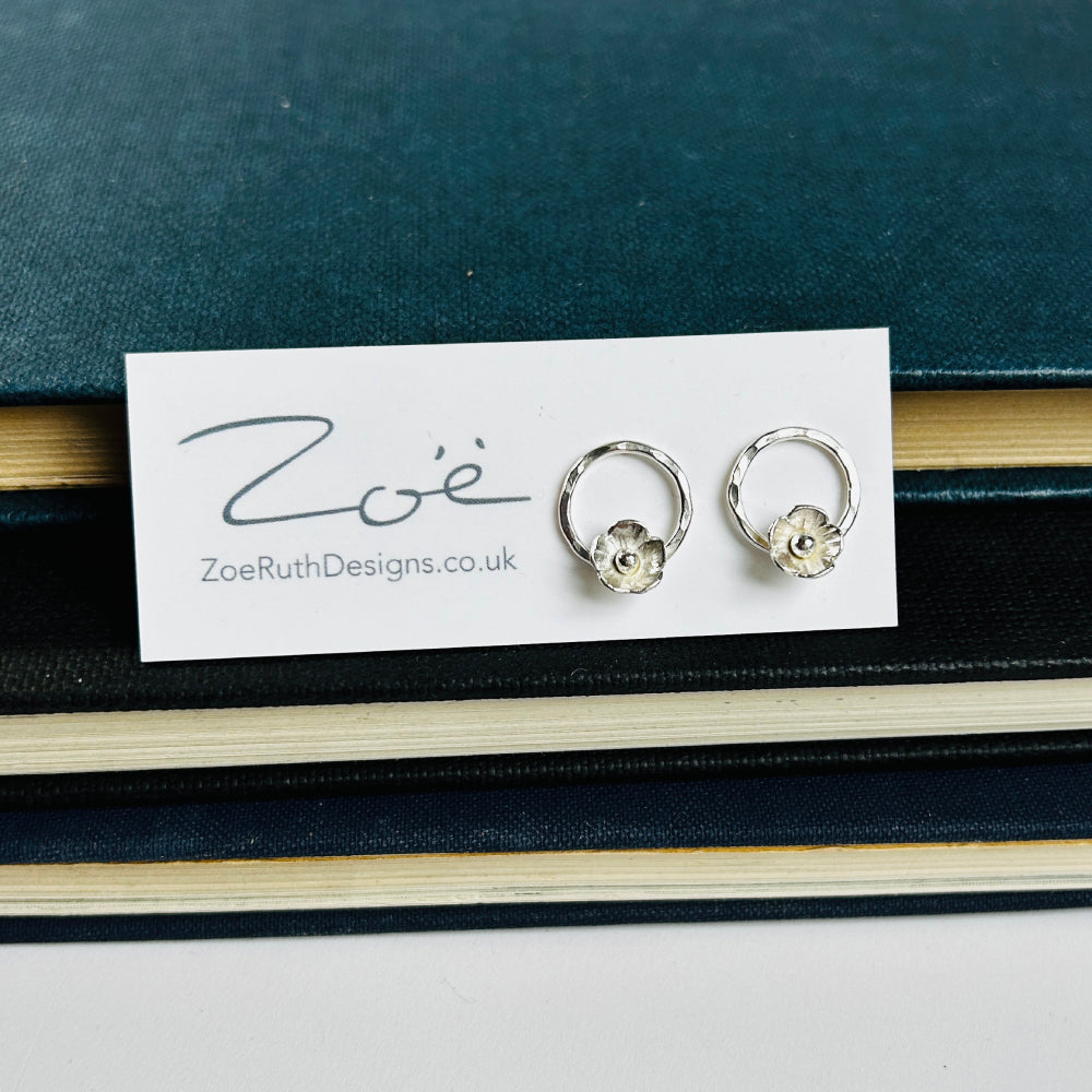 Handmade sterling silver stud earrings displayed on their logo card packaging of Zoe Ruth Designs