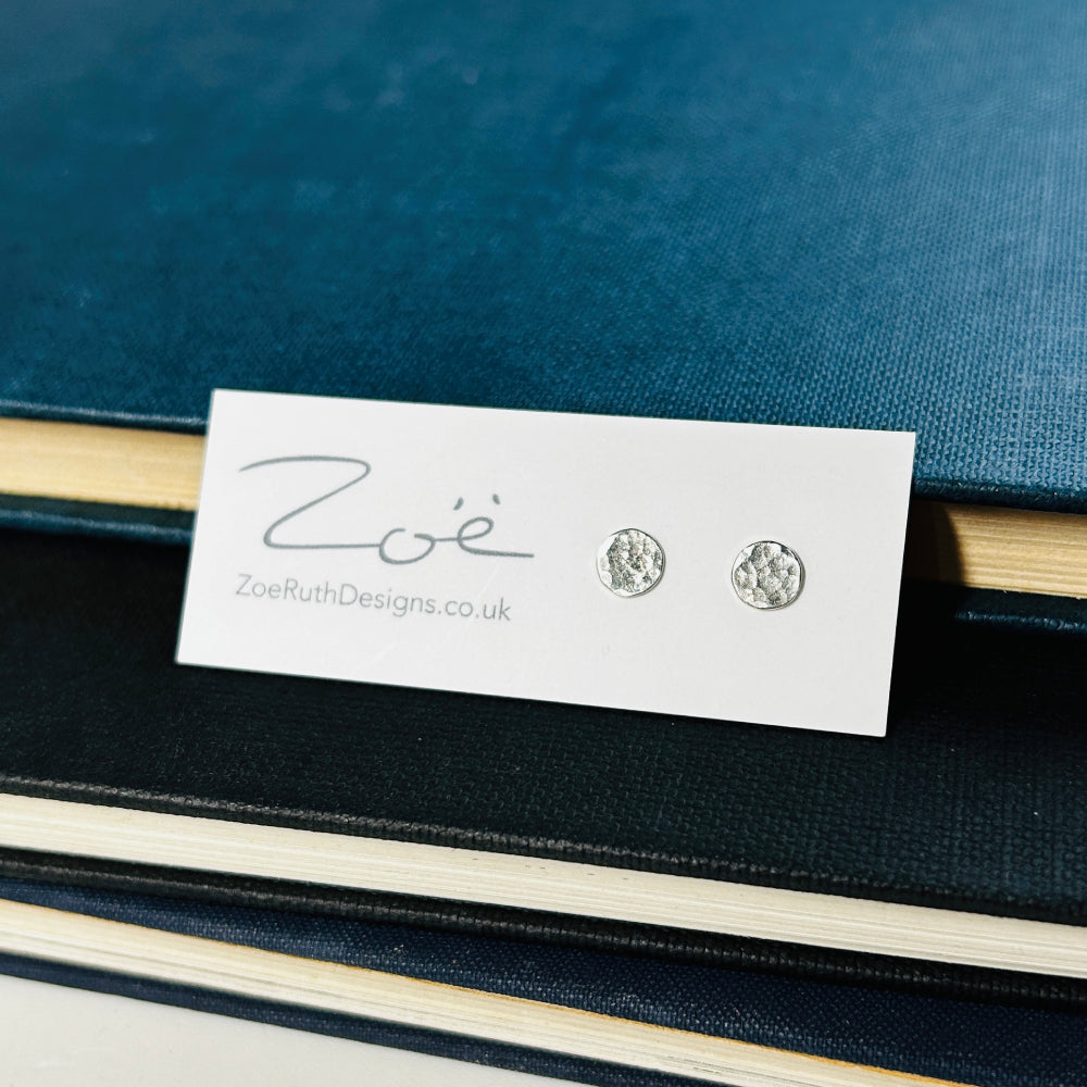 Handmade sterling silver stud earrings displayed on their logo card packaging of Zoe Ruth Designs