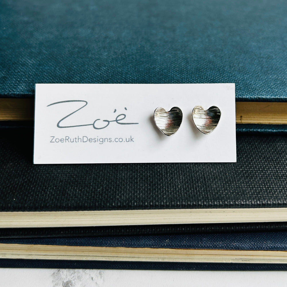 Handmade sterling silver stud earrings displayed on their logo card packaging of Zoe Ruth Designs
