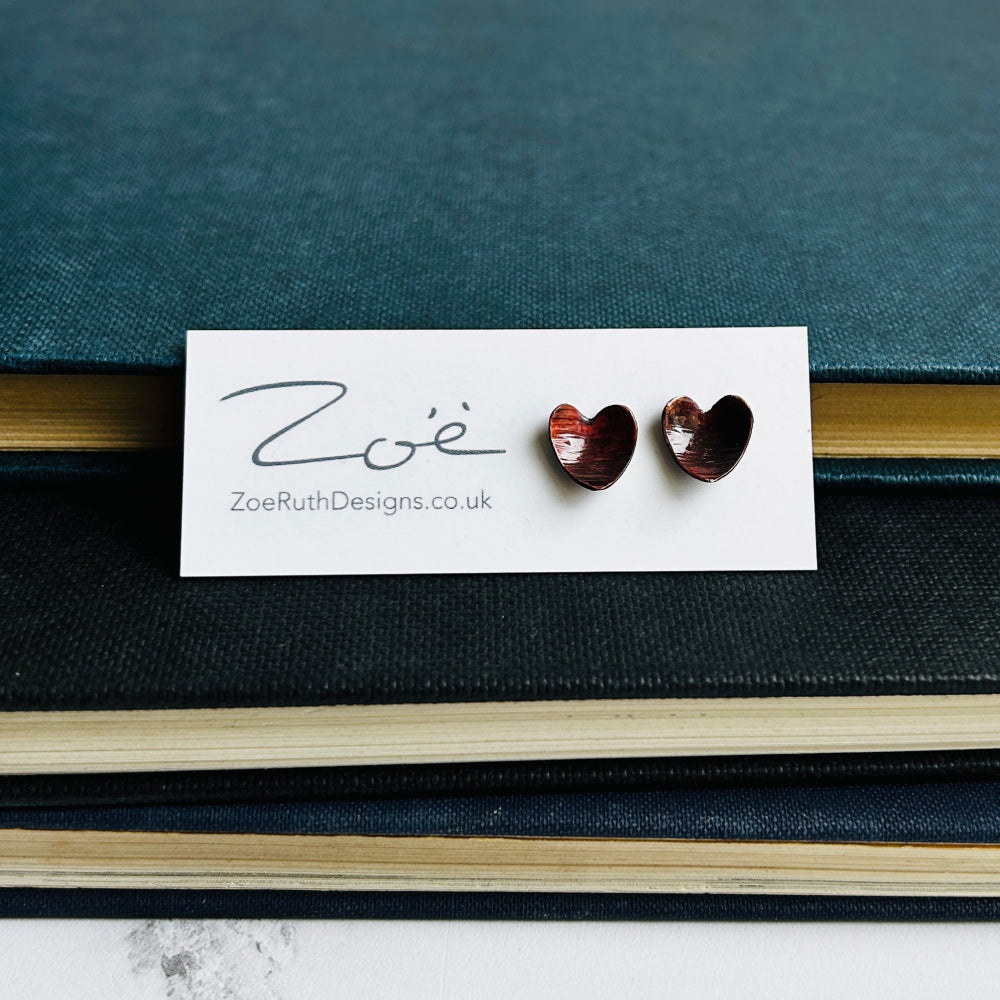 Handmade sterling silver stud earrings displayed on their logo card packaging of Zoe Ruth Designs