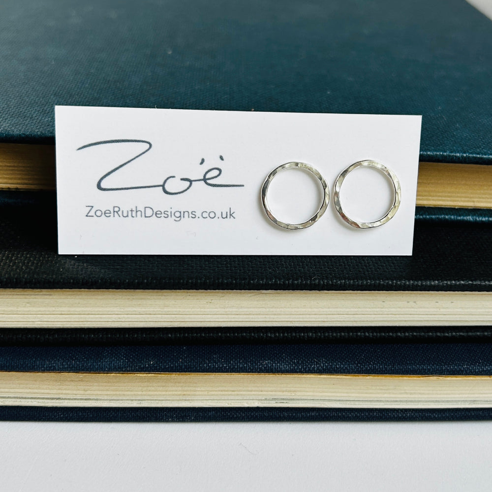 Handmade sterling silver stud earrings displayed on their logo card packaging of Zoe Ruth Designs