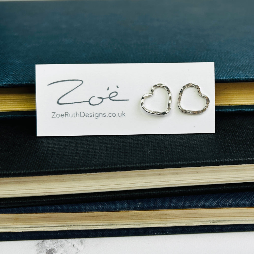 Handmade sterling silver stud earrings displayed on their logo card packaging of Zoe Ruth Designs