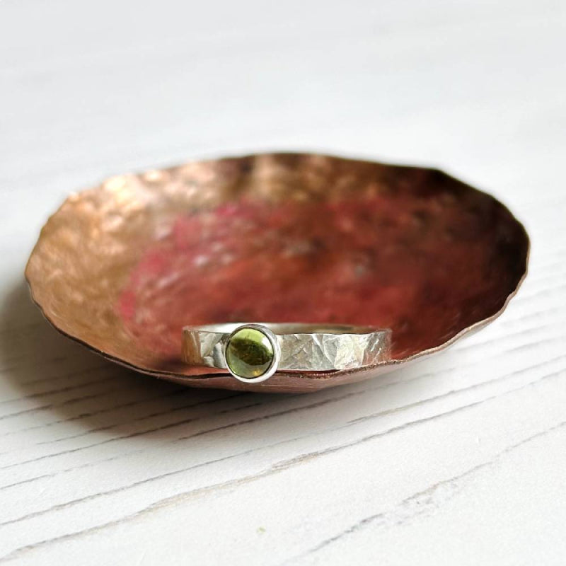 warm soft brown of smokey quartz stone on a textured silver ring