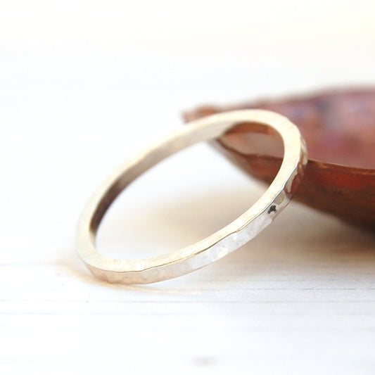 Silver stacking ring with a soft dimple texture, handmade by zoe ruth designs