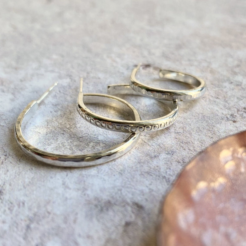 Dimple textured silver hoop studs