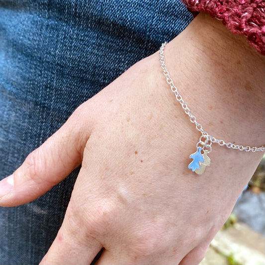 Sterling silver handmade oakleaf and acorn charm bracelet on wrist by Zoe Ruth Designs