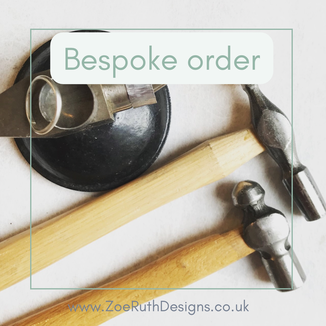 Tools including a hammer and chisel on a white surface with 'Bespoke order' text and website URL.