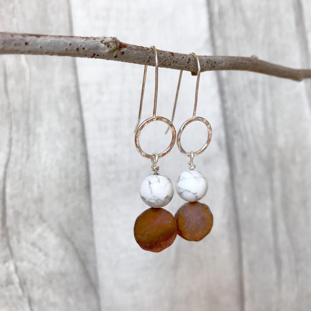 Hammered silver circles with white marbled with grey Howlite stones and coloured copper disk on fixed silver earring hooks, by zoe ruth designs