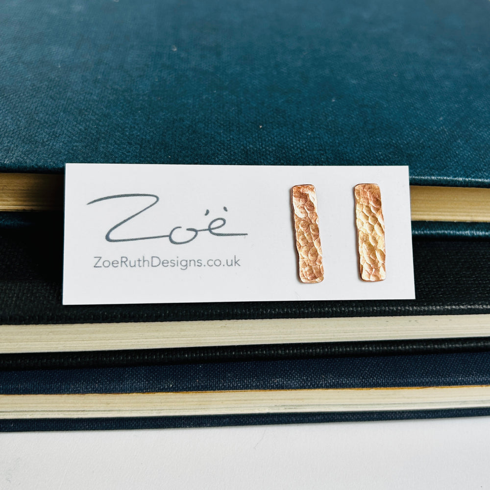 Handmade sterling silver stud earrings displayed on their logo card packaging of Zoe Ruth Designs