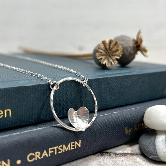 Silver heart on silver circle necklace
