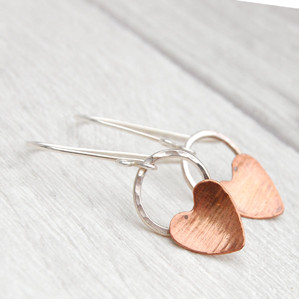 Copper heart and hammered silver circle earrings