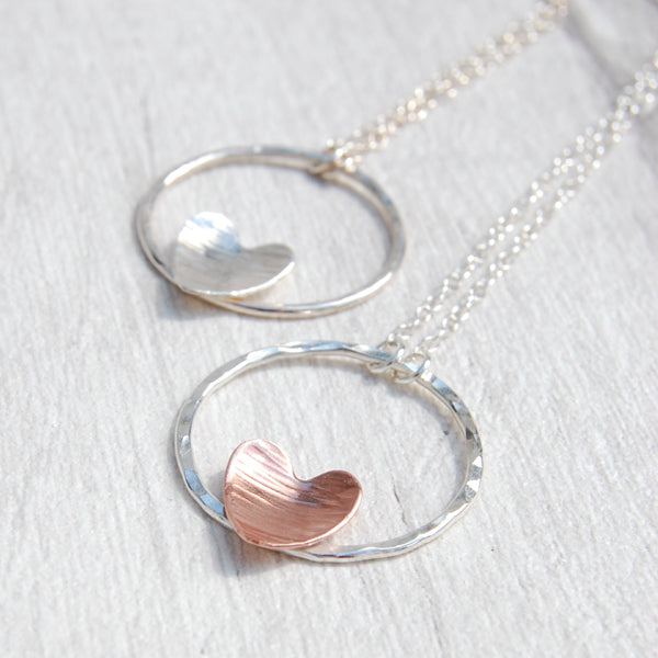 Copper heart on silver circle necklace