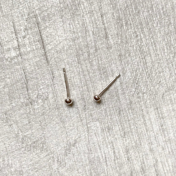 Small pebble like silver balls as stud earrings, by zoe ruth designs.