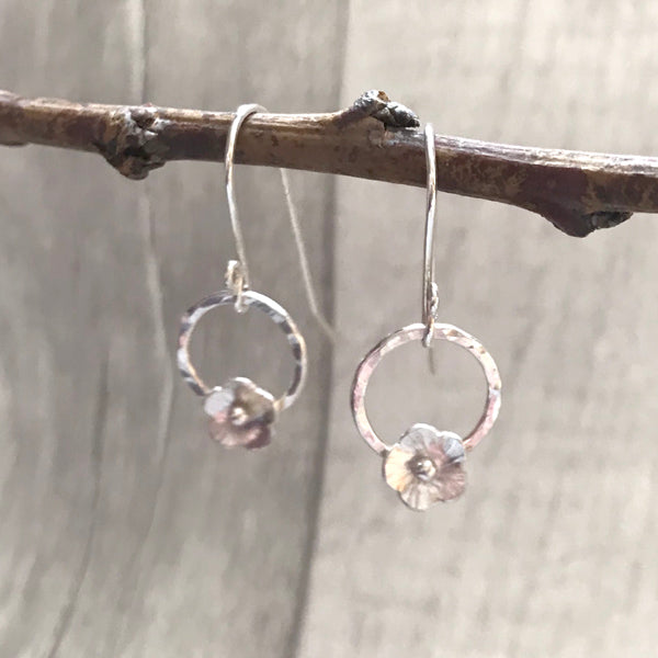 Silver flowers with circles on hooks