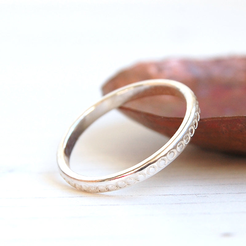 sterling silver stacking ring circles pattern stamped on it by zoe ruth designs