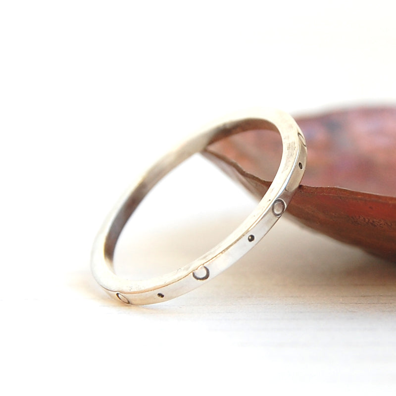 handmade sterling silver ring by zoe ruth designs with a circle and dot pattern